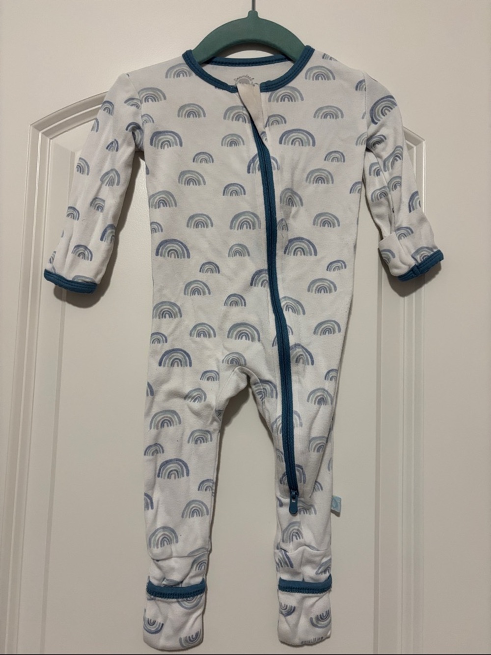 Dreamland Baby One-Piece Footed Zipper Pajamas in White with Blue Rainbows
